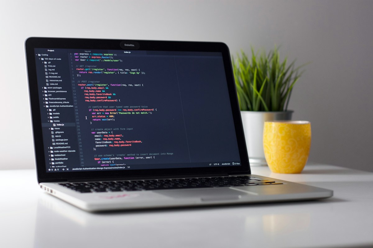 Modern laptop open with clean code editor in a focused study setup