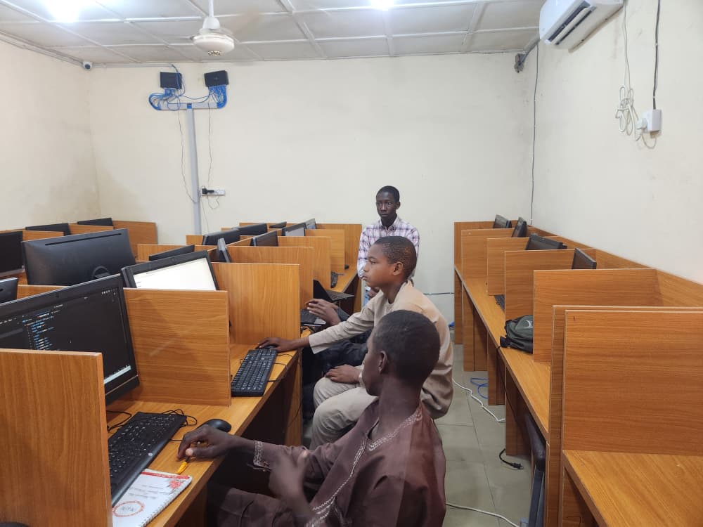 Syncbright learners coding on computers in the Yola lab